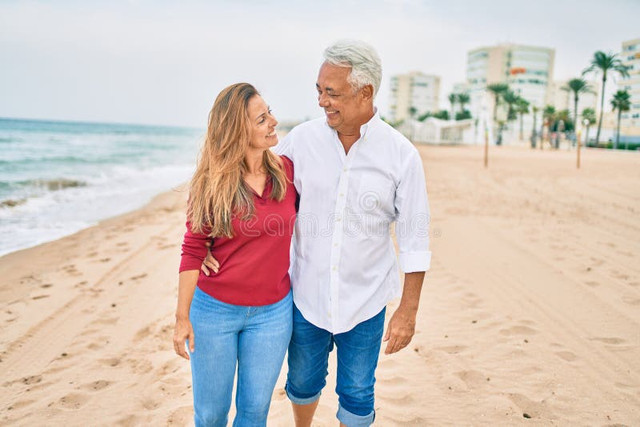 middle-age-hispanic-couple-smiling-happy-walking-beach-213167503